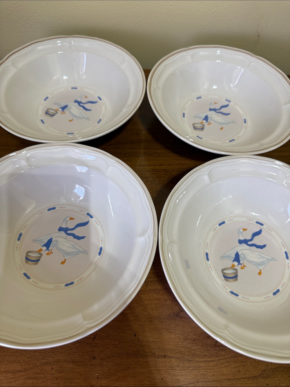White Dinnerware Bowls with Blue Goose Motif